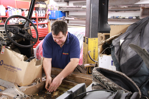 Jimbo scrapes off the original sound deadening to make painting easier and allow the Mk1 to shed a few kilos