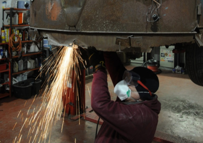 VW Bus cutting metal